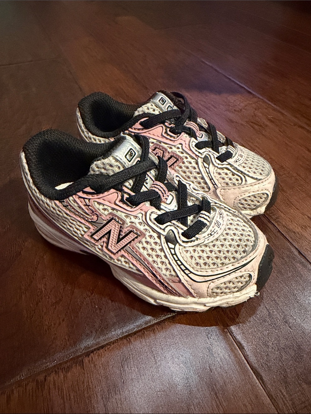 New Balance Kids Pink, White and Black Sneakers